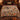 Harvest Turkey Thanksgiving woven blanket spread across a bed like a bedspread
