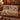 Harvest Turkey Thanksgiving woven blanket draped over a sofa, living room view