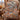 Hawk Migration Ridge Pattern woven blanket draped over a plaid wingback chair