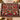 Personalized Heirloom Candlelight Conservatory woven blanket with custom family name draped over a sofa by a Christmas tree