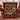 Evergreen and burgundy ornament family photo fleece throw on a red wingback armchair