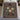 Hellebore bouquet woven blanket spread across a bed