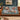 Hellebore Ornament Christmas woven blanket draped over a sofa in a holiday living room