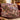 Heritage Tartan Lodge Christmas woven blanket with custom family name draped over a sofa, holiday room view