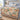 Heron Marsh Garden woven blanket spread on a bed