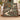 Holly orchard walk woven blanket draped over a sofa