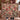 Couple holding a personalized Hollyhock & Christmas Rose Snow Garden woven blanket with custom family name