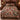 Hollyhock & Christmas Rose Snow Garden woven blanket with custom family name spread on a bed