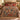 Hop & Wild Clematis woven blanket spread across a bed in a cozy bedroom