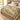 Hummingbird Trumpet Garden woven blanket spread on a bed
