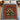 Iced Gingerbread Ornament Tree woven blanket spread on a bed with blue bedding