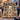 Illuminated Ketubah Arch Hanukkah fleece blanket design shown without a name draped over a blue armchair