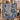Couple holding a personalized Indigo Hanukkah Lamps Around the World woven blanket with custom names