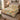Ivory Tiger Botanical quilt bedding set with 2 matching pillowcases on a bed in a cozy bedroom