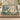 Kingfisher Waterlily Ribbons woven blanket draped over a sofa in a living room