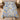 Lemon Garden quilt bedding set with 2 matching pillowcases on a bed in a cozy bedroom