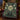 Luna moth medallion woven blanket styled on a velvet armchair