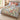 Monarch Prairie woven blanket spread on a bed