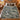 Mountain cabin woven blanket spread on a bed