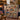 Nativity Patchwork Quilt Look woven blanket draped over a navy sofa beside Advent candles