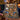 Nativity Story Mini Scenes woven blanket draped over a navy sofa beside Advent candles