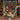 Holding a personalized Navy Nutcracker Pomegranate woven blanket with custom name woven in
