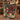 Couple holding a personalized Navy Nutcracker Pomegranate woven blanket with custom names woven in