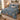 Navy Tulip Songbird Morris Style quilt bedding set with 2 matching pillowcases on a made bed