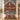 Personalized Nordic Santa's Workshop quilt with custom family name hung on a wall above a bench with matching pillowcases