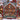 Nordic Santa's Workshop woven blanket displayed outdoors against a snowy red barn