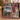 Nordic Village Lights woven blanket draped over a sofa