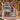 Nordic Village Lights woven blanket displayed outdoors on a festive Christmas porch
