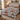 North Pole Village quilt bedding set with 2 matching pillowcases on a bed with Christmas decor