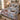 Northwoods Moose Christmas Creek quilt bedding set with 2 matching pillowcases on a bed with holiday decor