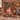 Woman holding a personalized Nutcracker Christmas House woven blanket with a custom name ribbon