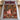 Nutcracker Christmas House woven blanket spread on a bed with burgundy pillows
