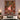 Nutcracker Christmas House woven blanket displayed as a wall tapestry above a bed