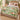 Orchid Conservatory woven blanket spread on a bed