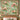 Orchid Conservatory woven blanket design shown without a name as a wall tapestry above a bed