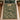 Owl Stream Forest woven blanket spread on a bed