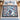 Painterly Blue Christmas Grove woven blanket spread on a bed