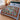 Partridge Pear Christmas woven blanket spread across a bed in a Christmas bedroom
