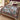 Passionflower Swallowtail Garden woven blanket spread across a bed in a cozy bedroom