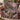 Pastel Halloween Tree Cottage woven blanket draped over a sofa