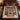 Patchwork Quilt Christmas photo blanket spread on a bed with evergreen bedding