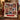 Patchwork Quilt Christmas photo blanket with nine family photos and a red name banner on a red armchair