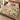 Peacock Dahlia Garden woven blanket spread on a bed