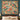 Peacock Dahlia Garden woven blanket design shown without a name as a wall tapestry above a bed