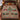 Barn star and fir tree Pennsylvania Dutch woven blanket spread on a bed