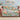 Peony Ribbon Garden woven blanket draped over a sofa